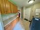 Laundry room with washer, dryer, and ample cabinetry at 11554 Monette Rd, Riverview, FL 33569