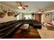 Spacious living room with a large sectional sofa, mounted TV, and unique decor at 11554 Monette Rd, Riverview, FL 33569