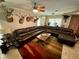 Spacious living room with a large sectional sofa, mounted TV, and unique decor at 11554 Monette Rd, Riverview, FL 33569