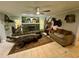 Living room with stone fireplace, mounted wildlife, and large alligator rug at 11554 Monette Rd, Riverview, FL 33569