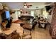 Spacious living room with a large sectional sofa, mounted TV, and unique decor at 11554 Monette Rd, Riverview, FL 33569