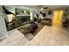 Spacious living room with a stone fireplace and mounted wildlife at 11554 Monette Rd, Riverview, FL 33569