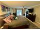 Main bedroom with king-size bed and private access to backyard at 11554 Monette Rd, Riverview, FL 33569
