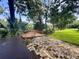 Brick patio area leading to a wooden deck overlooking the river at 11554 Monette Rd, Riverview, FL 33569