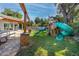 Backyard with pergola, playset and grassy area at 121 Live Oak Ln, Largo, FL 33770