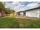 Private backyard with a small deck and grassy lawn at 1448 S Hercules Ave, Clearwater, FL 33764