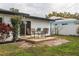 Small deck with table and chairs, providing an outdoor patio space at 1448 S Hercules Ave, Clearwater, FL 33764