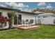 Newly built deck in a backyard with seating for four at 1448 S Hercules Ave, Clearwater, FL 33764
