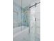 Modern bathroom with a large walk-in shower and a soaking tub at 1448 S Hercules Ave, Clearwater, FL 33764