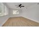 Well-lit bedroom with wood flooring and window blinds at 1448 S Hercules Ave, Clearwater, FL 33764