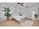 Main bedroom with a comfortable bed, dresser and view into the dining room at 1448 S Hercules Ave, Clearwater, FL 33764