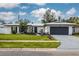 Charming ranch-style home with a modern exterior and well-maintained landscaping at 1448 S Hercules Ave, Clearwater, FL 33764
