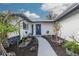 Landscaped walkway leading to the front entrance of a remodeled home at 1448 S Hercules Ave, Clearwater, FL 33764