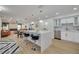 Modern kitchen with white cabinets, quartz countertops, and stainless steel appliances at 1448 S Hercules Ave, Clearwater, FL 33764