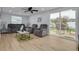 Relaxing living room with grey couches, a coffee table, and access to a patio at 1448 S Hercules Ave, Clearwater, FL 33764