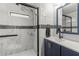 Modern bathroom with marble-look tile and a walk in shower at 14912 Brookridge Blvd, Brooksville, FL 34613