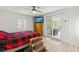 Bedroom with sliding glass doors to backyard and ceiling fan at 14912 Brookridge Blvd, Brooksville, FL 34613