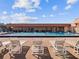 Inviting community pool with lounge chairs at 14912 Brookridge Blvd, Brooksville, FL 34613