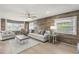 Bright living room featuring wood-look floors and ample seating at 14912 Brookridge Blvd, Brooksville, FL 34613