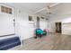 Relaxing screened porch with wood-look flooring and seating at 14912 Brookridge Blvd, Brooksville, FL 34613