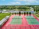 Two well-maintained tennis courts at 14912 Brookridge Blvd, Brooksville, FL 34613