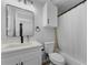 Updated bathroom with white vanity, new toilet and shower at 1725 Pine Ridge E Way # E, Palm Harbor, FL 34684