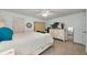 Spacious bedroom with a dresser and a full-size bed at 1725 Pine Ridge E Way # E, Palm Harbor, FL 34684