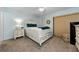 Charming bedroom with white bedroom set and a ceiling fan at 1725 Pine Ridge E Way # E, Palm Harbor, FL 34684