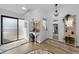 Bright and airy entryway with a mirrored wall and wood flooring at 1725 Pine Ridge E Way # E, Palm Harbor, FL 34684