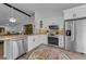 Updated kitchen with stainless steel appliances at 1725 Pine Ridge E Way # E, Palm Harbor, FL 34684