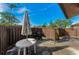 Small patio with table, umbrella, and grill at 1725 Pine Ridge E Way # E, Palm Harbor, FL 34684