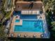 Aerial view of refreshing community pool at 1725 Pine Ridge E Way # E, Palm Harbor, FL 34684