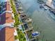 Aerial view showing waterfront property with boat slips and walkway at 175 Medallion Blvd # F, Madeira Beach, FL 33708