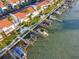 Aerial view of waterfront property with boat slips and community at 175 Medallion Blvd # F, Madeira Beach, FL 33708