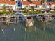 Aerial view of waterfront property with boat slips and private docks at 175 Medallion Blvd # F, Madeira Beach, FL 33708