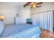 Bright bedroom featuring a blue comforter and built-in dresser at 175 Medallion Blvd # F, Madeira Beach, FL 33708