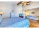 Spacious bedroom with a queen bed and sitting area at 175 Medallion Blvd # F, Madeira Beach, FL 33708