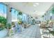Relaxing common area with wicker furniture and large windows at 175 Medallion Blvd # F, Madeira Beach, FL 33708