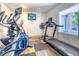 Small fitness center equipped with elliptical and treadmill at 175 Medallion Blvd # F, Madeira Beach, FL 33708