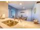 Kitchen with granite countertops, double sink and breakfast bar at 175 Medallion Blvd # F, Madeira Beach, FL 33708
