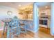 Bright, updated kitchen with white cabinets and granite countertops at 175 Medallion Blvd # F, Madeira Beach, FL 33708