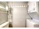 Compact laundry area with stacked washer and dryer units at 175 Medallion Blvd # F, Madeira Beach, FL 33708