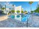 Refreshing community pool with plenty of lounge chairs at 175 Medallion Blvd # F, Madeira Beach, FL 33708