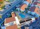 Elevated view of a community pool and surrounding buildings at 175 Medallion Blvd # F, Madeira Beach, FL 33708