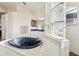 Elegant bathroom with a black soaking tub and glass block accents at 18520 Oak Way Dr, Hudson, FL 34667