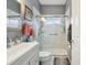 Updated bathroom with gray vanity, walk-in shower, and modern fixtures at 18520 Oak Way Dr, Hudson, FL 34667