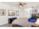Spacious bedroom with large bed, wood dresser, and mounted TV at 18520 Oak Way Dr, Hudson, FL 34667