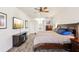 Bright bedroom featuring a king-size bed and plenty of natural light at 18520 Oak Way Dr, Hudson, FL 34667
