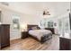 Bright bedroom with wood flooring and a king-size bed at 18520 Oak Way Dr, Hudson, FL 34667