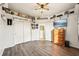 Charming bedroom with wood dresser, mounted TV, and ample closet space at 18520 Oak Way Dr, Hudson, FL 34667